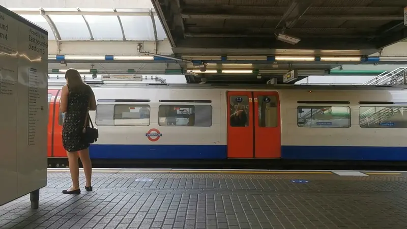 A Piccadilly line train at a covered platform at Hammersmith