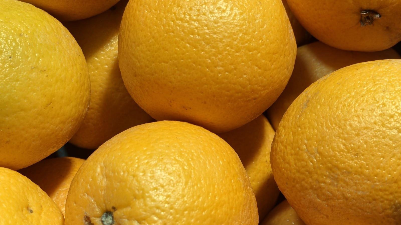 Fresh oranges stacked at a London market stall